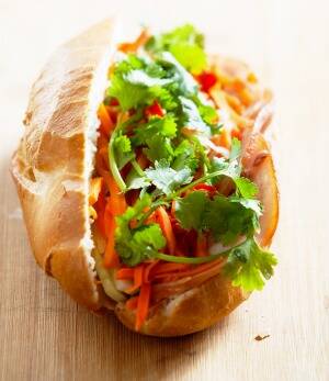 Stuff cold roast meats into a bahn mi-style roll with pate, chilli and coriander. Photo: Kristoffer Paulsen   