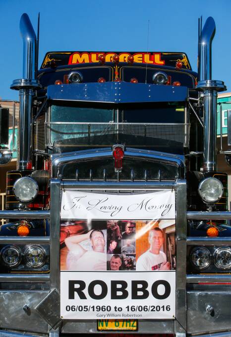 farewell robbo: A convoy of up to 20 trucks escorted the truck carrying Gary Robertson's coffin from the funeral service. Pictures: Adam McLean