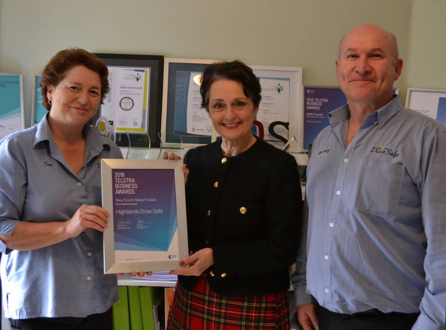 THANK YOU: Highlands Drive Safe owners Sue (left) and Murray Tyler receive a certificate of congratulations from Goulburn MP Pru Goward. Photo by Sophie Buchanan