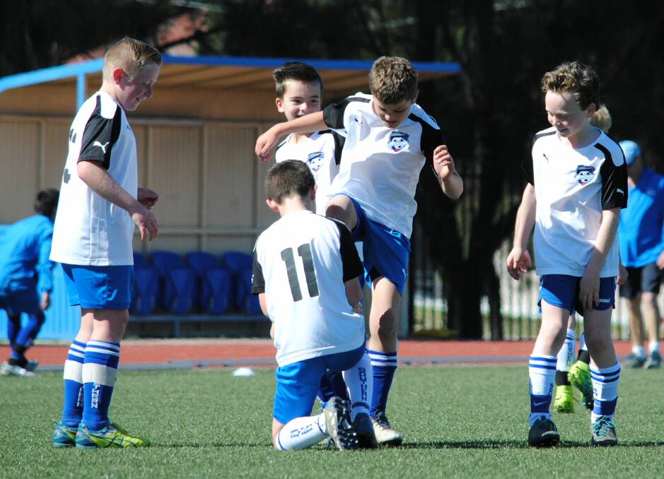 FUN TIMES: Bayley Cash, Kynan Denford, Oscar Lambie, Aaron Hage and Freddy Ash join together for a goal celebration for the under-10s White team on Sunday. Photo supplied