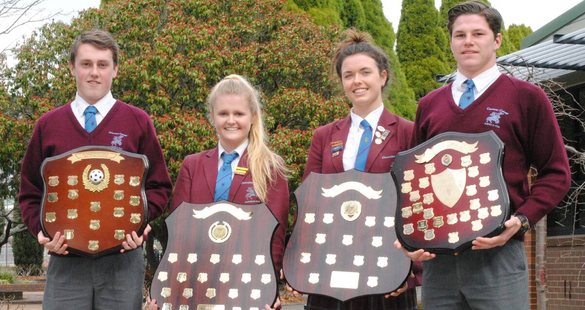 WINNERS: Successful Chevalier College sports captains Hugh McRae, Clover Menzies, Annabel Good and Liam O'Malley with the spoils from Saturday. Photo: Josh Bartlett