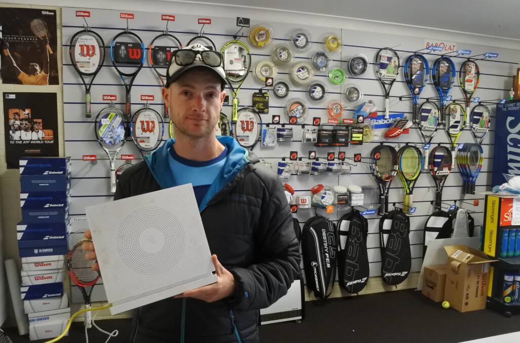 Tristan Whitehill, owner of Complete Tennis in Bowral, which has been without internet for more than three weeks since the installation of the NBN. Photo: Charli Shield. 