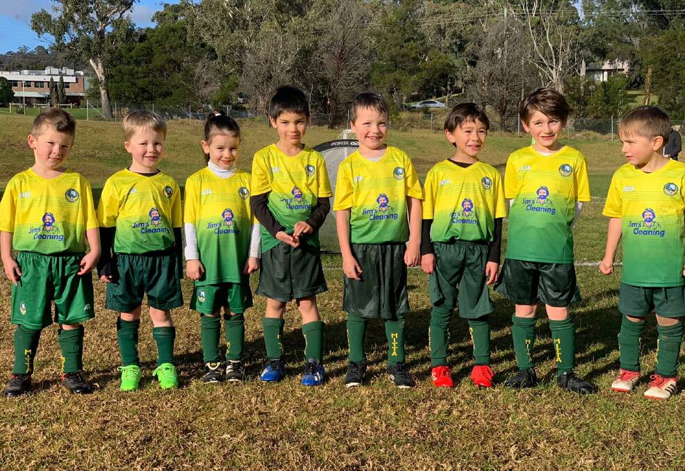 STARS: The Mittagong Under 6 Yellow side took part in their first match and were all smiles. Photo supplied: Mittagong Football Club.
