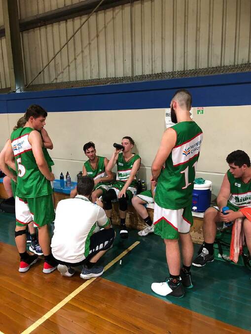 The Moss Vale Magic during a timeout whilst competing at the Canberra Classic. 