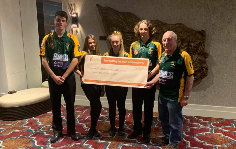 Presenting the cheque on behalf of the board of directors was Vice President Roger Cole and our Pathways Ambassadors Chelsea Pickering Emma Keeley Jasper Murphy and Tom Eccelston.