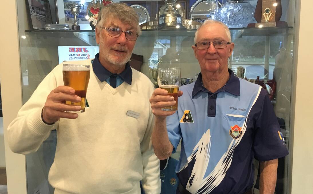 TASTE OF VICTORY: Mike Holmwood and Robin Staples enjoying a refreshing beverage after their 2019 Moss Vale Motor Group Challenge victory.