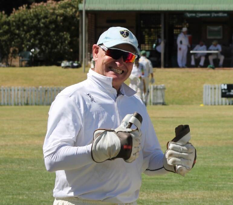 ALL SMILES: Ian Bradburn is all smiles behind the wickets.