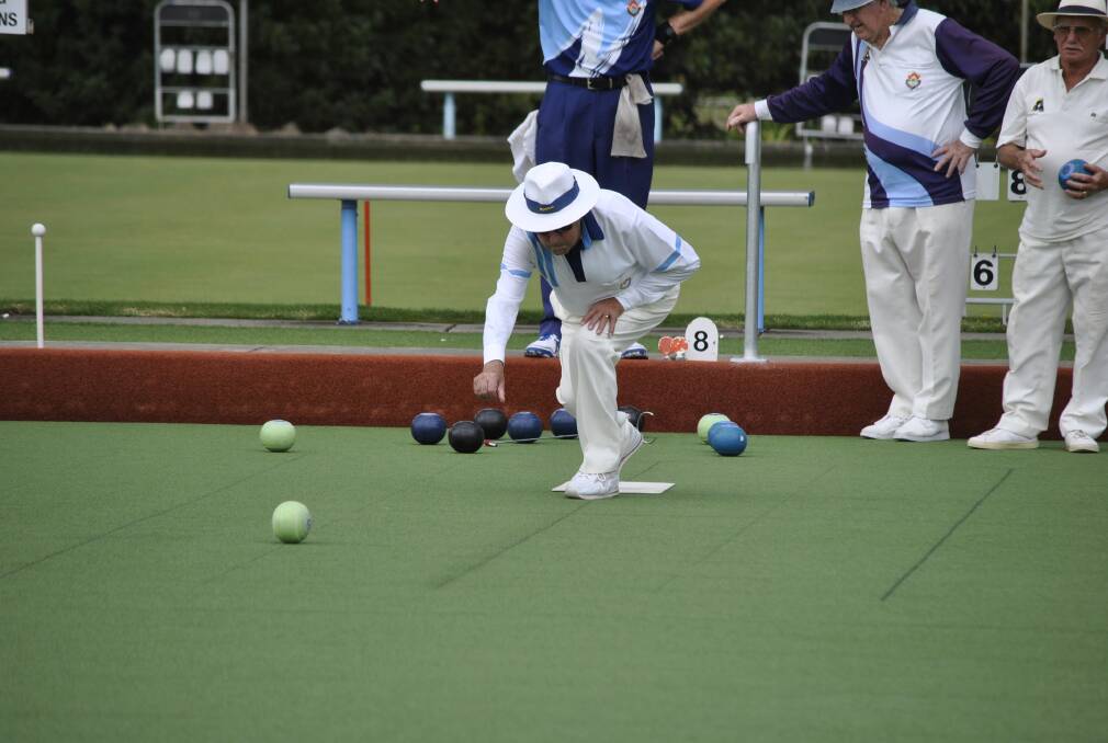 Gordon Lewis with the perfect form, beating the heat and enjoying a game of bowls. 