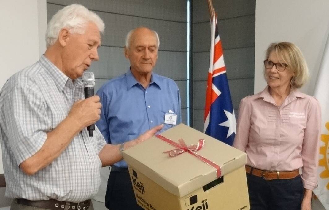 Helen Denning is presented with the ipods from Rotary club representatives Gerry Kroon and David McCosh. Photos: supplied