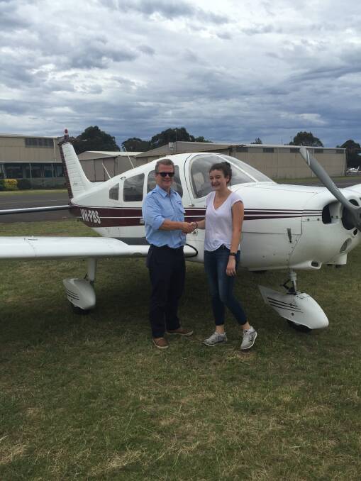 Tully Mahr with her flight instructor Kevin  Warrell on the day of her first solo flight. Photo supplied