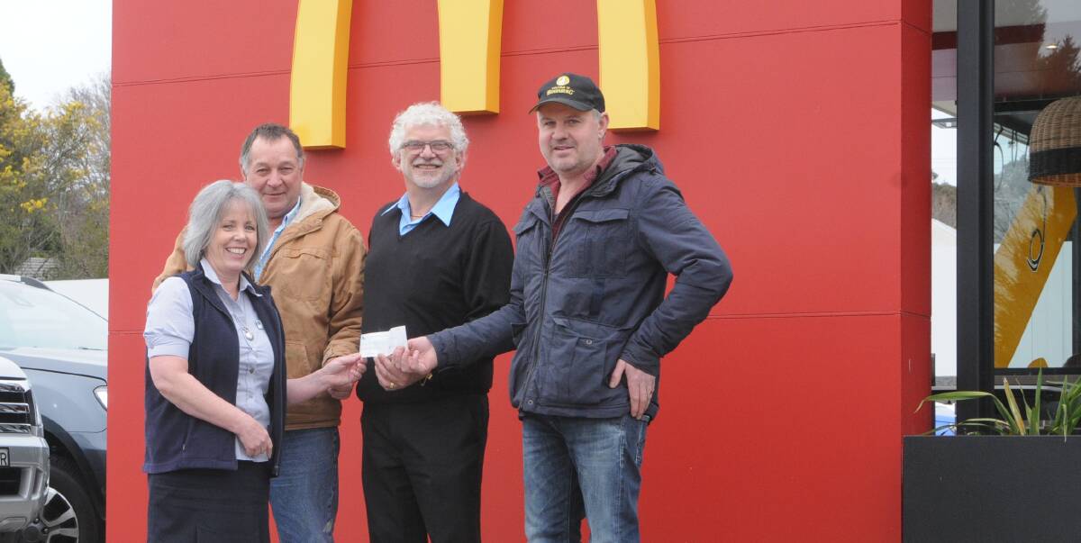 SHOW OF SUPPORT: Moss Vale Rodeo Association president Kevin Tangye presented a $10,000 cheque to Jo Pearson from the Southern Highlands Cancer Centre along with Graham Marcolin (McDonalds) and Matt Dunn (Jemmy Moss). 