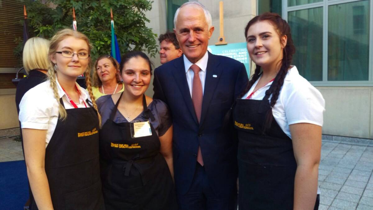 CATERING SUCCESS: Koori Kulcha's Tash, Tammy and Rhonda with Prime Minister Malcolm Turnball at the cocktail party. Photo: supplied