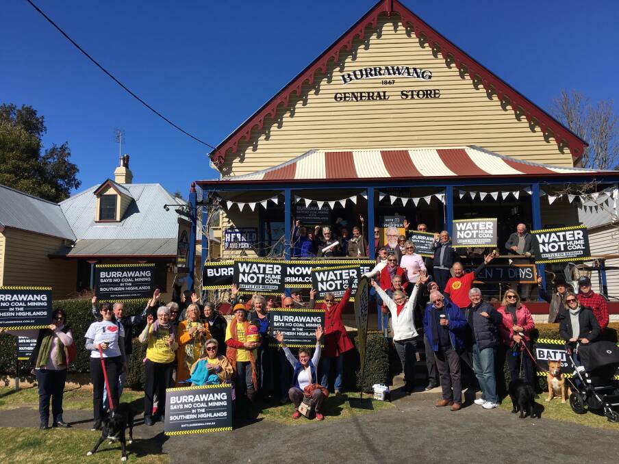 Members of Battle for Berrima and the Burrawang community presented mayor Larry Whipper with the results of the third community survey on Saturday. Burrawang has been declared a 'coal free' village. Photo supplied