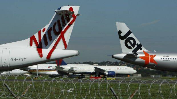 Dozens of domestic flights were grounded at Sydney Airport on Thursday due to high winds.  Photo: Louise Kennerley