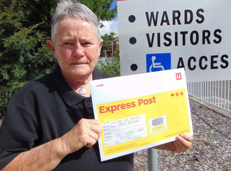 CONCERNED: Public Health First chairman Edna Carmichael posting a letter with questions and concerns to health minister Brad Hazzard. Photo: supplied. 