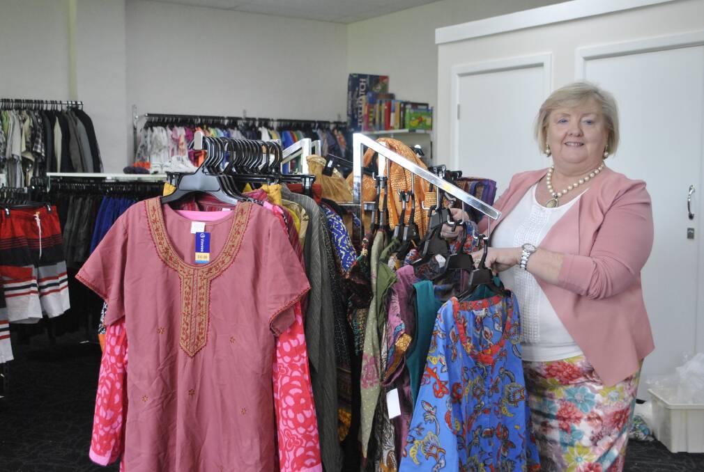VINNIES REOPENING: St Vincent de Paul volunteer Eileen getting the store ready for the upcoming re-opening. Photo: Madeline Crittenden. 