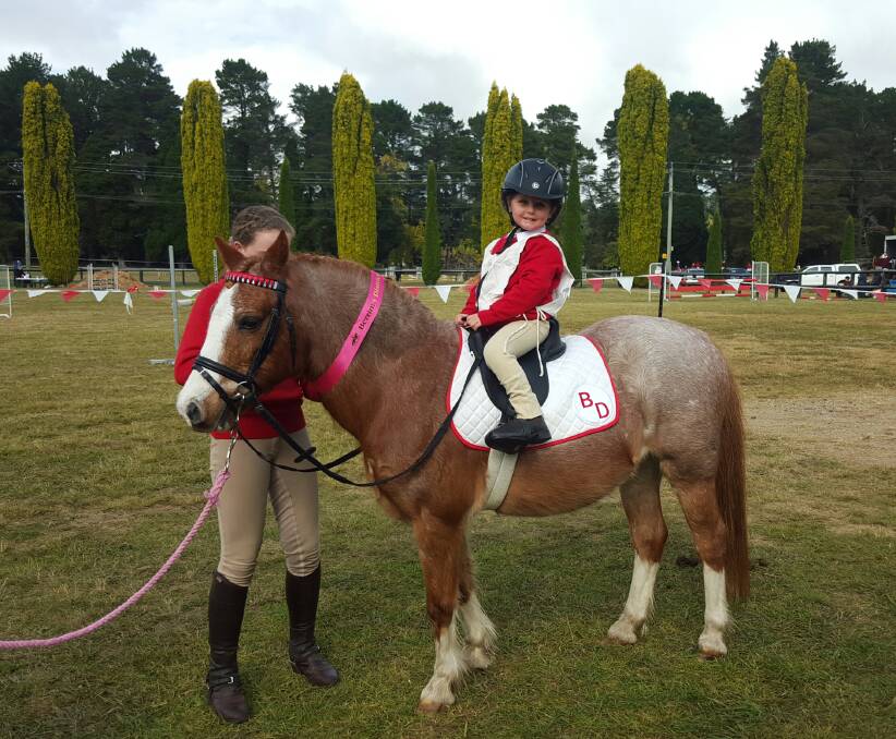 MINI WINNER: Three year old rider Chloe Motycka won the Mini E grade at the Berrima District Pony Club Showjumping and Derby Day. Photo: supplied. 