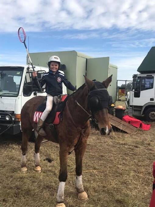 ORANGE CARNIVAL: Wollondilly's Scarlett Geddes on her horse Happy at the Orange Polocrosse Carnival on June 17 and 18. Photo: supplied. 