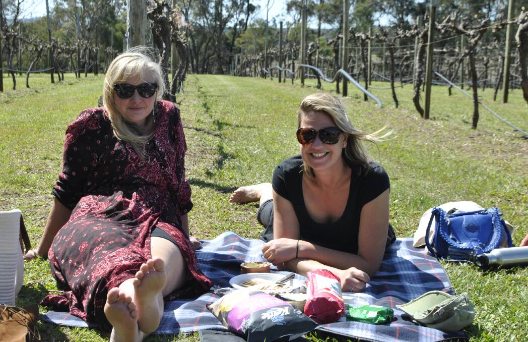 VINEYARD MUSIC: Susan Maloney and Pascalle Nelemans enjoying Kiss The Frog who performed live at Joadja Estate on October 2. Photo: Madeline Crittenden. 