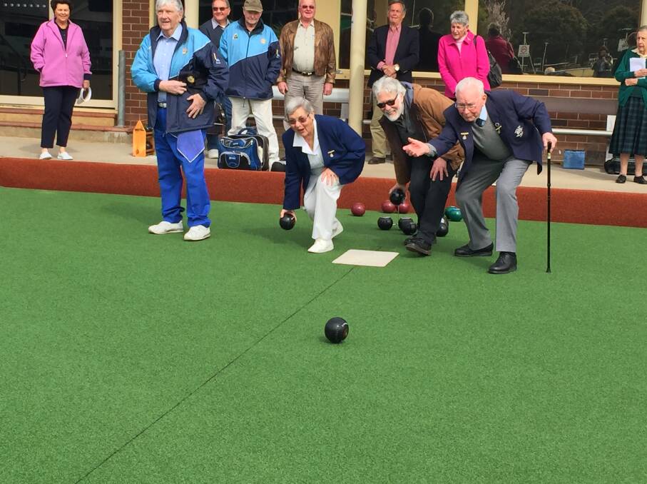 (L-R) Bowral Bowling Club deputy chairman Brian Payne, chairman Elaine Jones, mayor Larry Whipper and patron Lou Wilson send the first bowl down the green. Photo: Madeline Crittenden. 