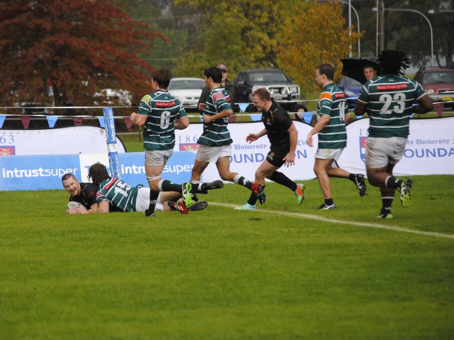 HOME GROUND VICTORY: Tim Small secures a try in the second half of the match against Wonoona Shamrocks. Photo: Claire Fenwicke. 