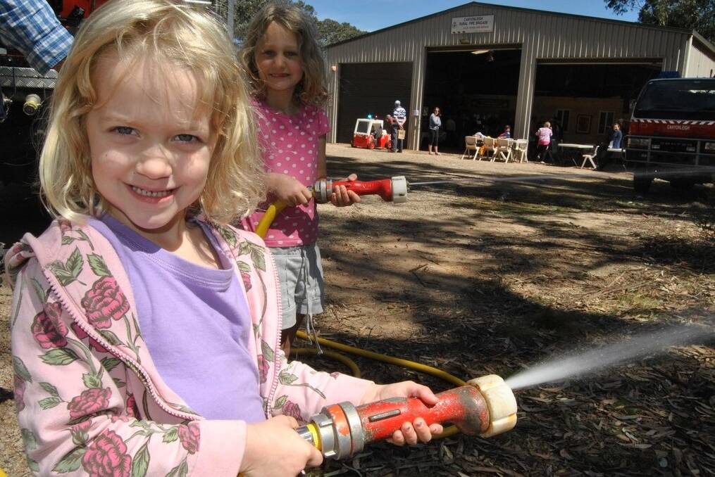TIME TO GET READY: Kids share in the fun with a hose demonstration at last year's Canyonleigh Get Ready event. Photo: supplied. 