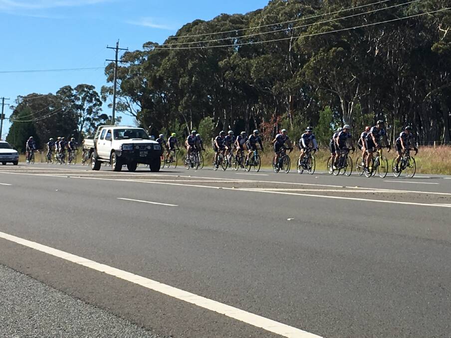 FUNDRAISING RIDE: NSW police officers cycling into Mittagong on April 28 to raise funds for NSW Police Legacy. Photo: Madeline Crittenden. 
