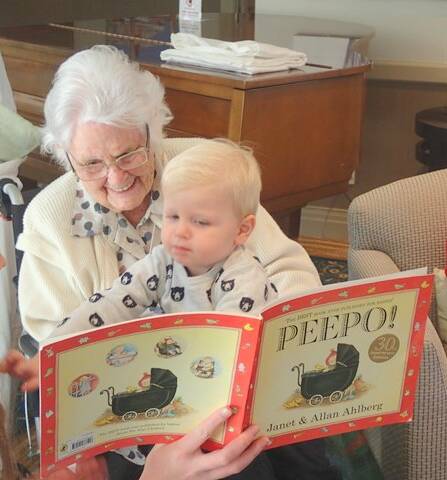 BABIES AND ELDERLY BOND: Bowral House residents read and play with babies from around the Highlands twice a month. 