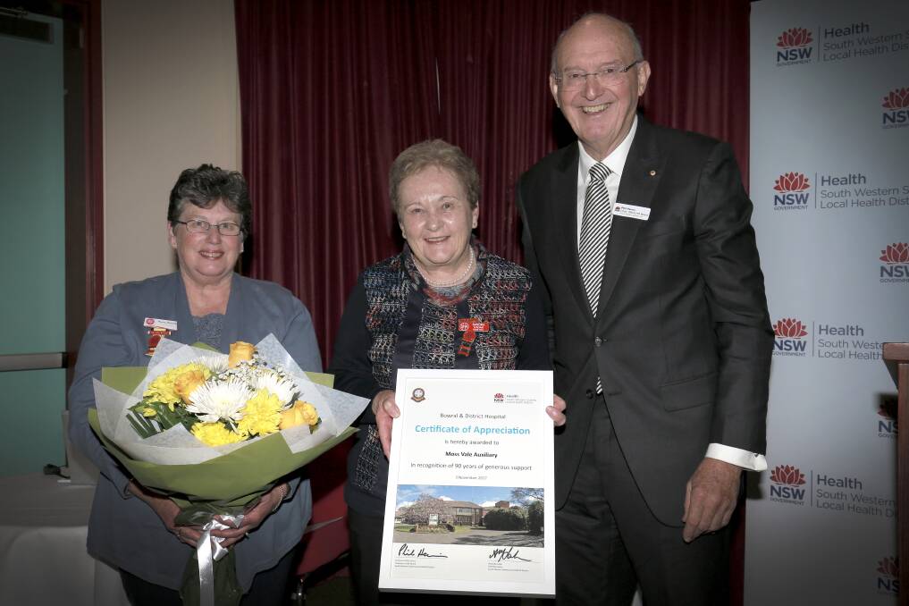 APPRECIATIVE: Board chair professor Phillip Harris AM presenting Moss Vale Hospital Auxiliary's Sandra D'Adam and Penny Barcicki with a certificate of appreciation. 