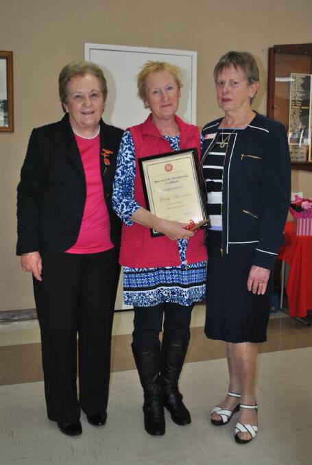 LIFE MEMBER: Moss Vale Hospital Auxiliary member Jenny Sheerman (middle) receiving her life membership from president Sandra D'Adam and United Hospital Auxiliaries of NSW Inc Illawarra representative Sandra Walter. Photo: Madeline Crittenden. 