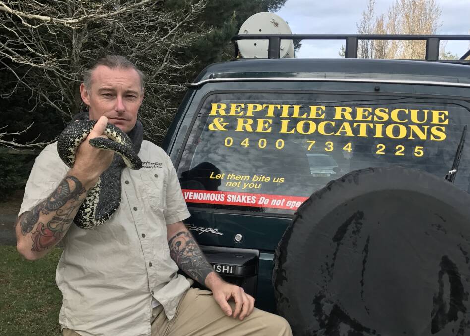 SNAKE CATCHER: Highlands snake catcher Ray McGibbon with a diamond python he relocated on September 11. Photo: supplied. 