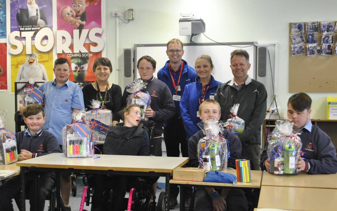 PRIZE WINNERS: Moss Vale High students with Officeworks Mittagong staff and teachers on October 16. Photo: Madeline Crittenden. 