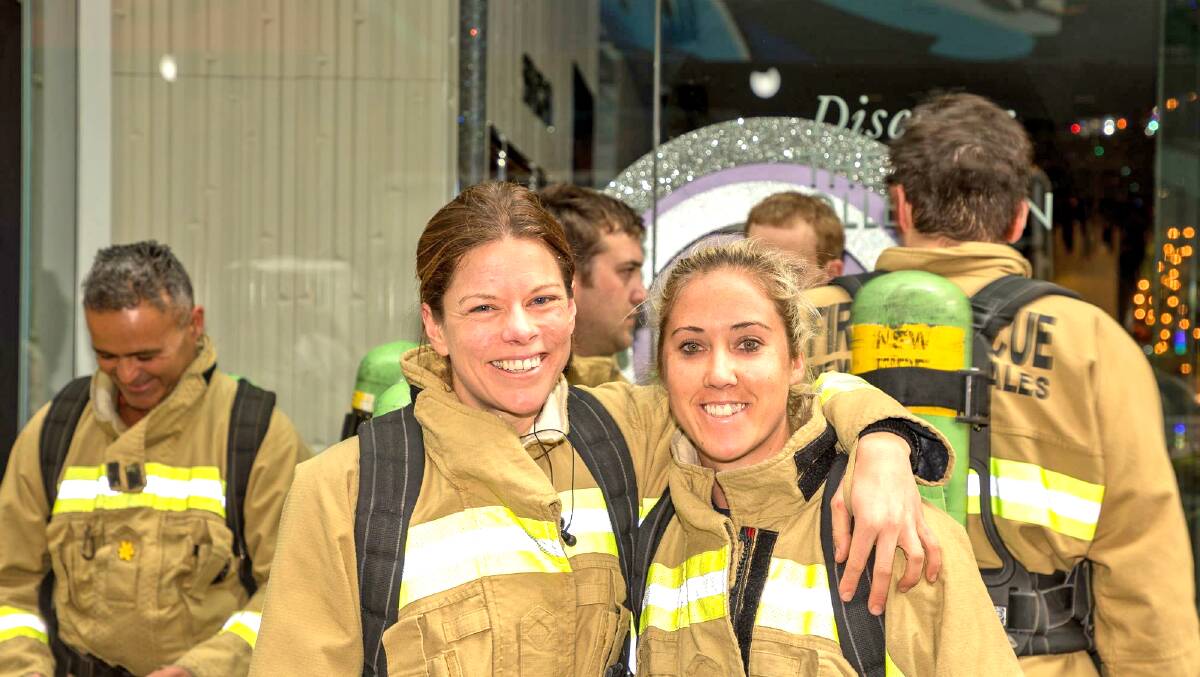 STAIR CLIMB: Caitlin Danyi (right) with fellow firefighter Mel Hayes at Sydney Tower. 