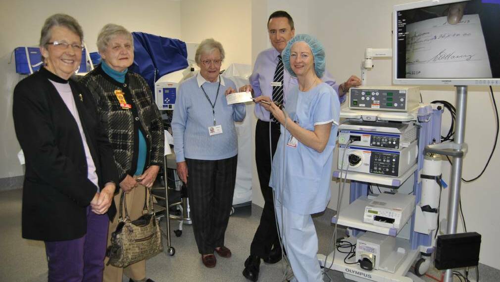 Bowral Auxiliary handing over new equipment. 
