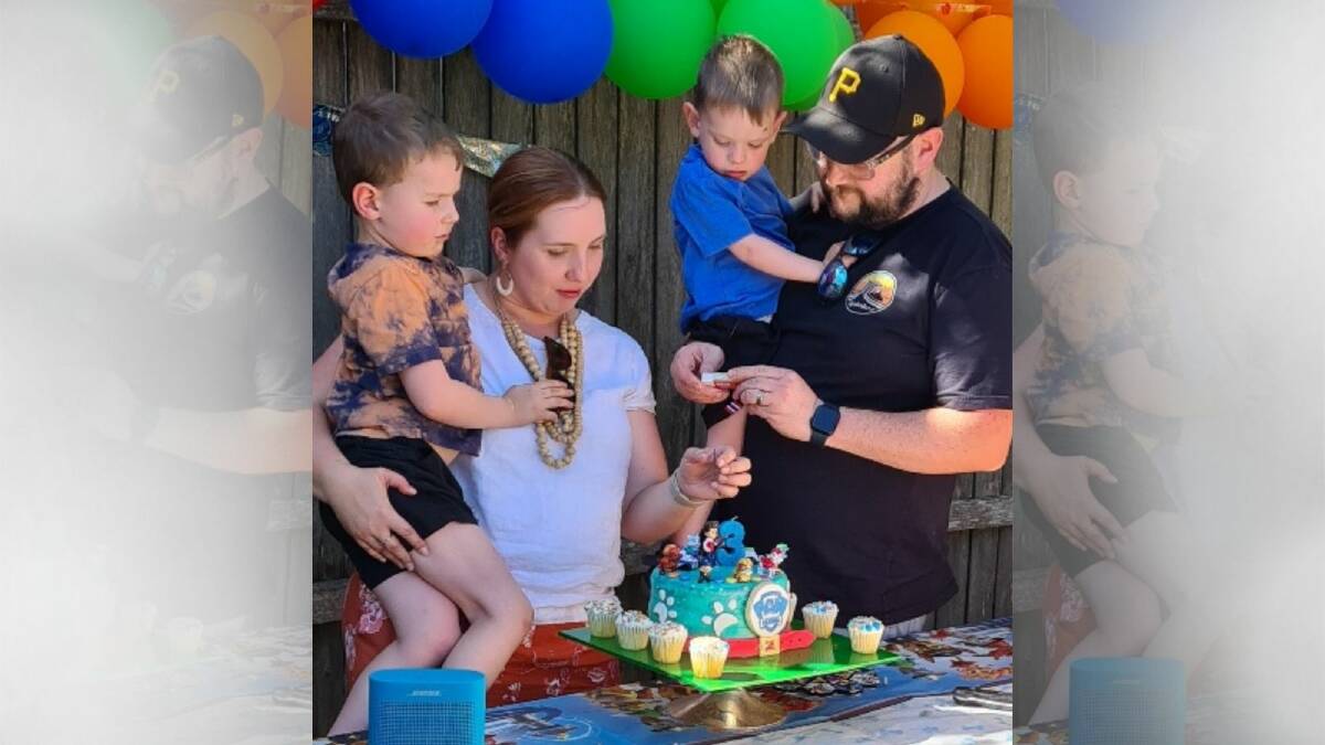 Harvey Lowcock, centre right, enjoys his third birthday cake with brother Luca, mum Stacey and dad Shane. Picture supplied