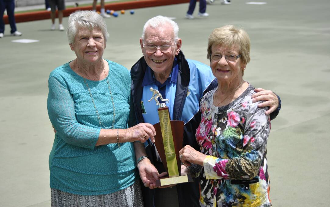 TRIBUTE: John Crowe's sister Elva Wright, patron of Bowral Bowling Club Lew Wilson and Crowe's wife Jocelyn Crowe with the Crowe-Brenning Cup. Photo: Emily Bennett
