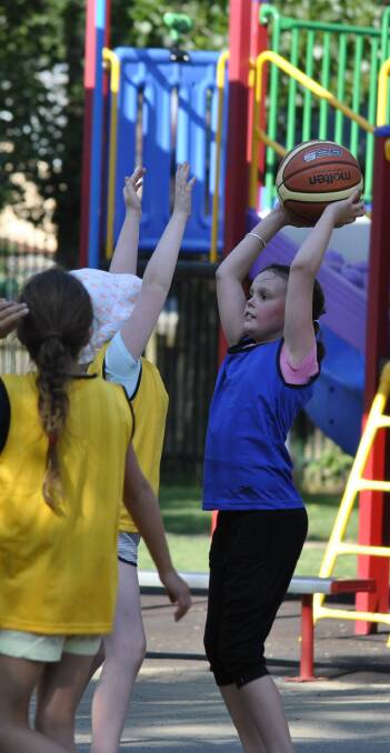 FOCUSED: Little Spirit player Emily Bellington in action on the basketball court at St Thomas Acquinas in Bowral on Monday. Photo: Emily Bennett