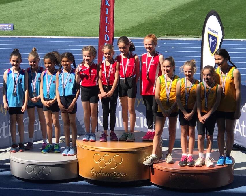 PODIUM FINISH: Holly Rae, Millie Poulos, Claudia Clunn and Grace Frost won gold medals at the NSW MacKillop State Title at Sydney Olympic Park. Photo: Contributed