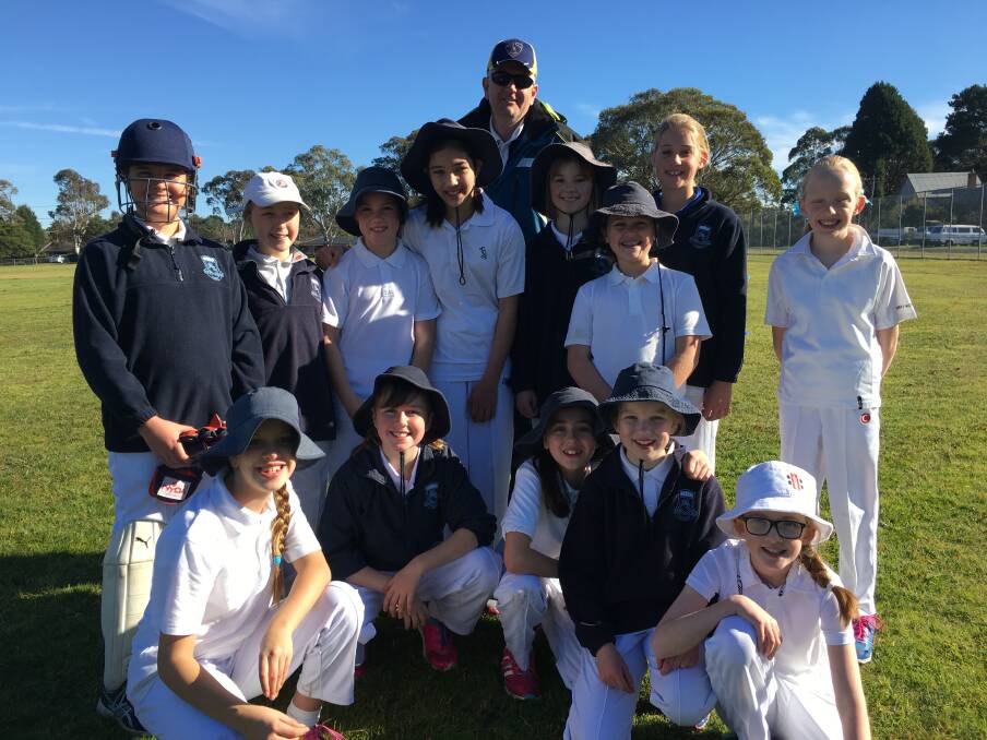 GOOD GAME: Bowral Public School's girls cricket team with coach Matthew Watson after the win at the NSW PSSA girls cricket knock-out competition. Photo: Contributed