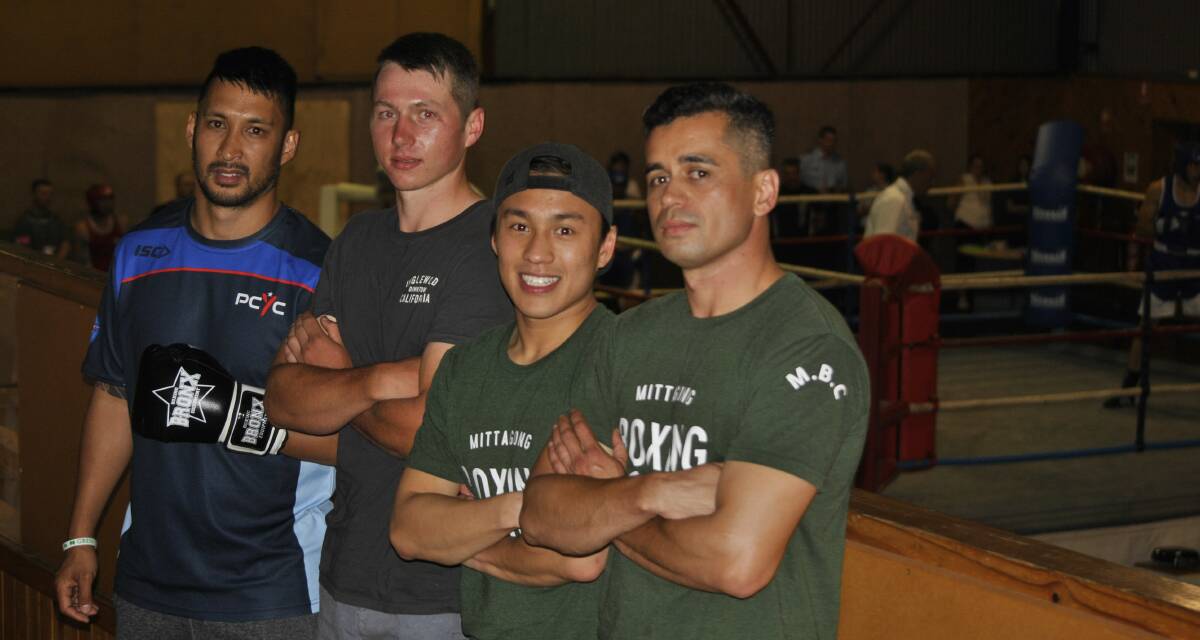 IN THEIR ELEMENT: PCYC Southern Highlands senior coach Alberto Good with boxers Nick O'Brien, Derek Lam and Neil Crowe at the charity fight night on Saturday.
