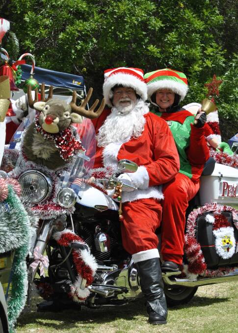 ROAD TO CHRISTMAS CHEER: Wollondilly Wanderers members Bob and Robyn Colefax took part in the Christmas ride on Saturday. Photo: Emily Bennett