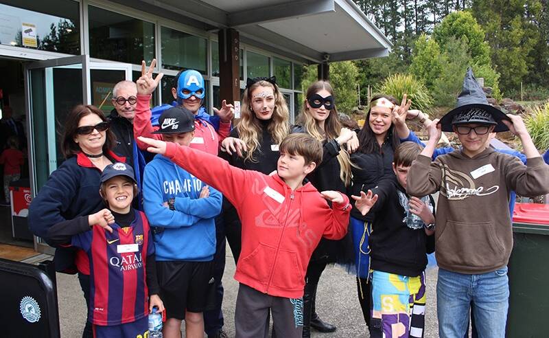 Some of the Kookaburra Kids with volunteers and superheroes at Illawarra Fly during the school holidays. Photo: supplied