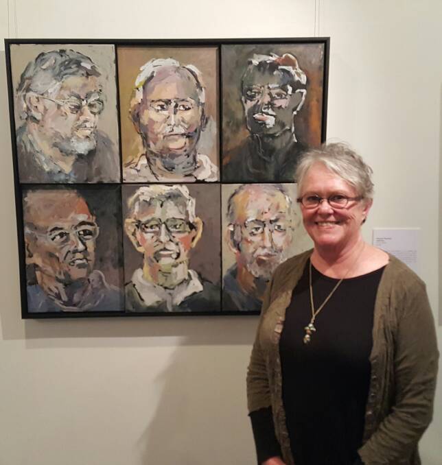 Robyn Kinsela with the winning portraits of Highlands Vietnam veterans. Photo: supplied