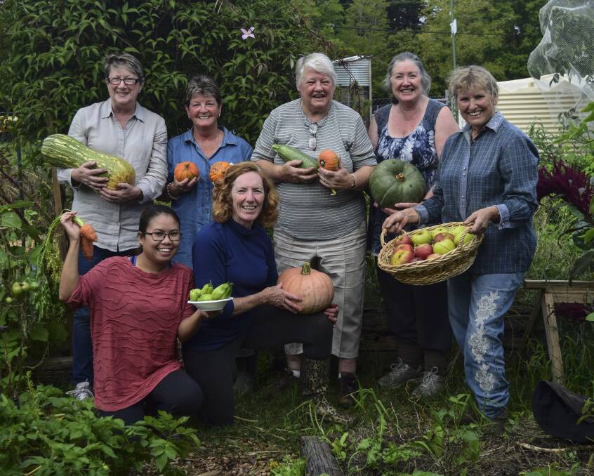 Moss Vale Community Garden members (back) Narelle James, Chris Shute, Jo O'Brien, Zita Rigby, Jill Cockram, (front) Joy Weir and Moira Hamilton with some of their award-winning produce. Photo: supplied