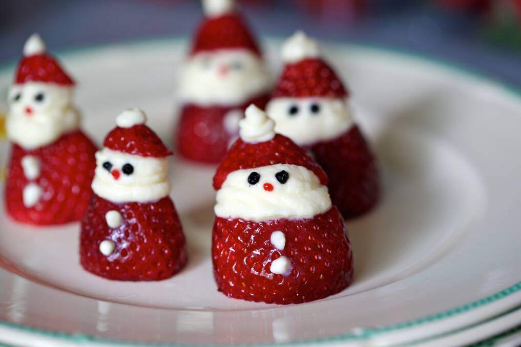 Get creative with Christmas food alternatives, such as these Strawberry Santas. Photo: FDC