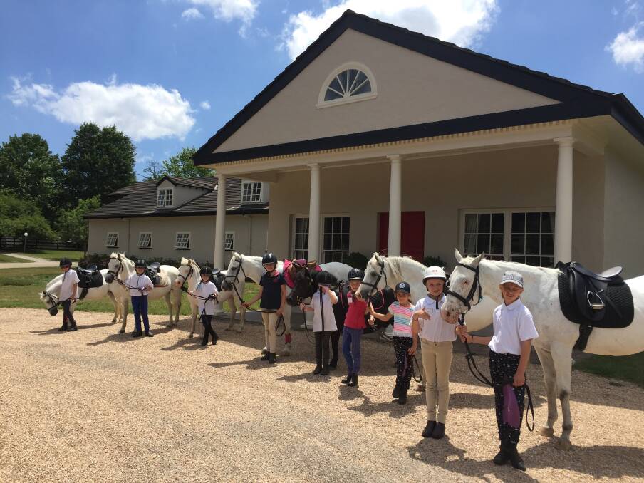 Children at a recent school holiday horse clinic at Sutton Farm Equestrian Centre. Photo: supplied
