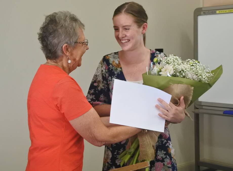 Centenary Scholarship recipient Anna Isbester accepting her award from judging panel member Joan Lowe. Photo: Claire Fenwicke