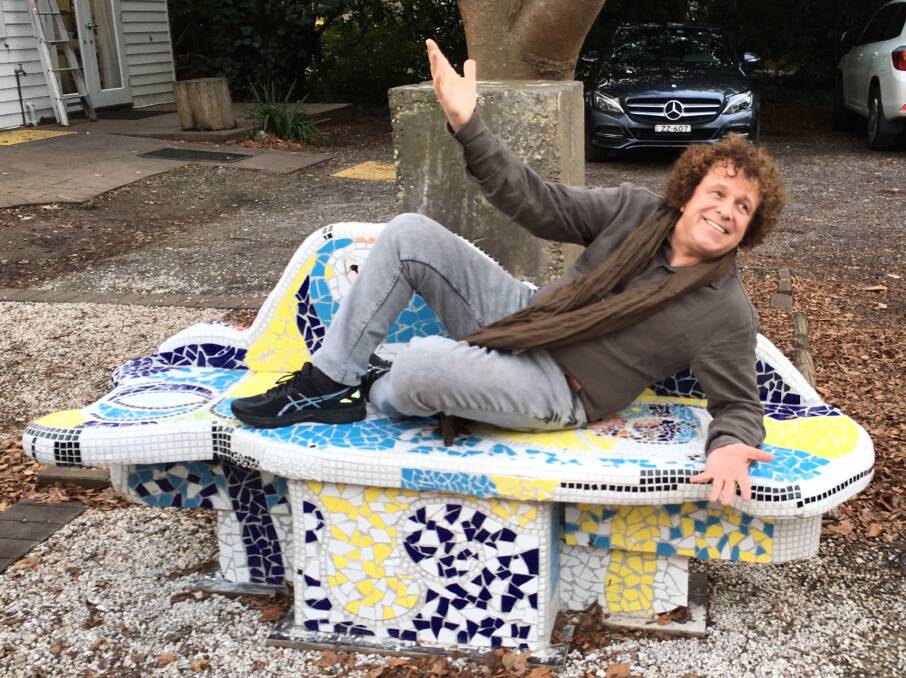 Singer/songwriter Leo Sayer reclining on an outdoor seat at the BDAS Gallery before his portrait session. Photo: supplied