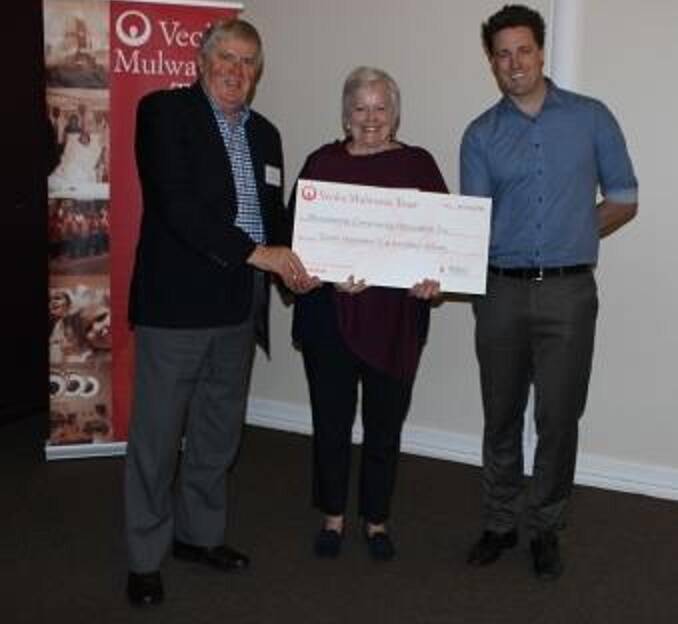 Delighted: Members of the Bundanoon Community Association accepting a cheque from the Veolia Mulwaree Trust. Photo: supplied