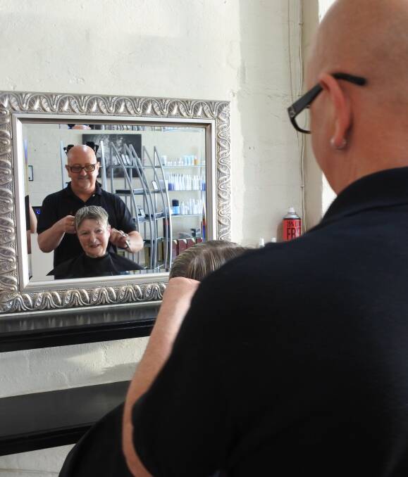 Cut above: Ha Ha Hair's Paul Stone sharpening his skills with Robyn Baker before his trip to the Philippines for not-for-profit organisation Hair Aid. Photo: Claire Fenwicke